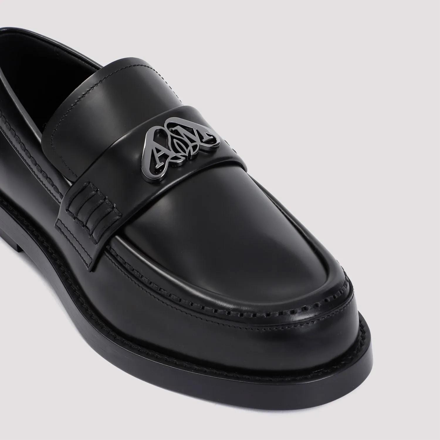 ALEXANDER MCQUEEN Edgy Black Slip-On Loafers for Women with Luxurious Silver Hardware