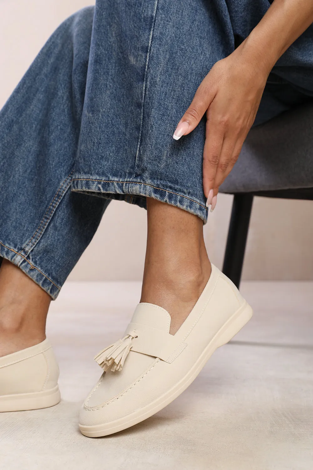 KENYA SLIP ON LOAFER WITH TASSEL DETAILING IN BEIGE SUEDE