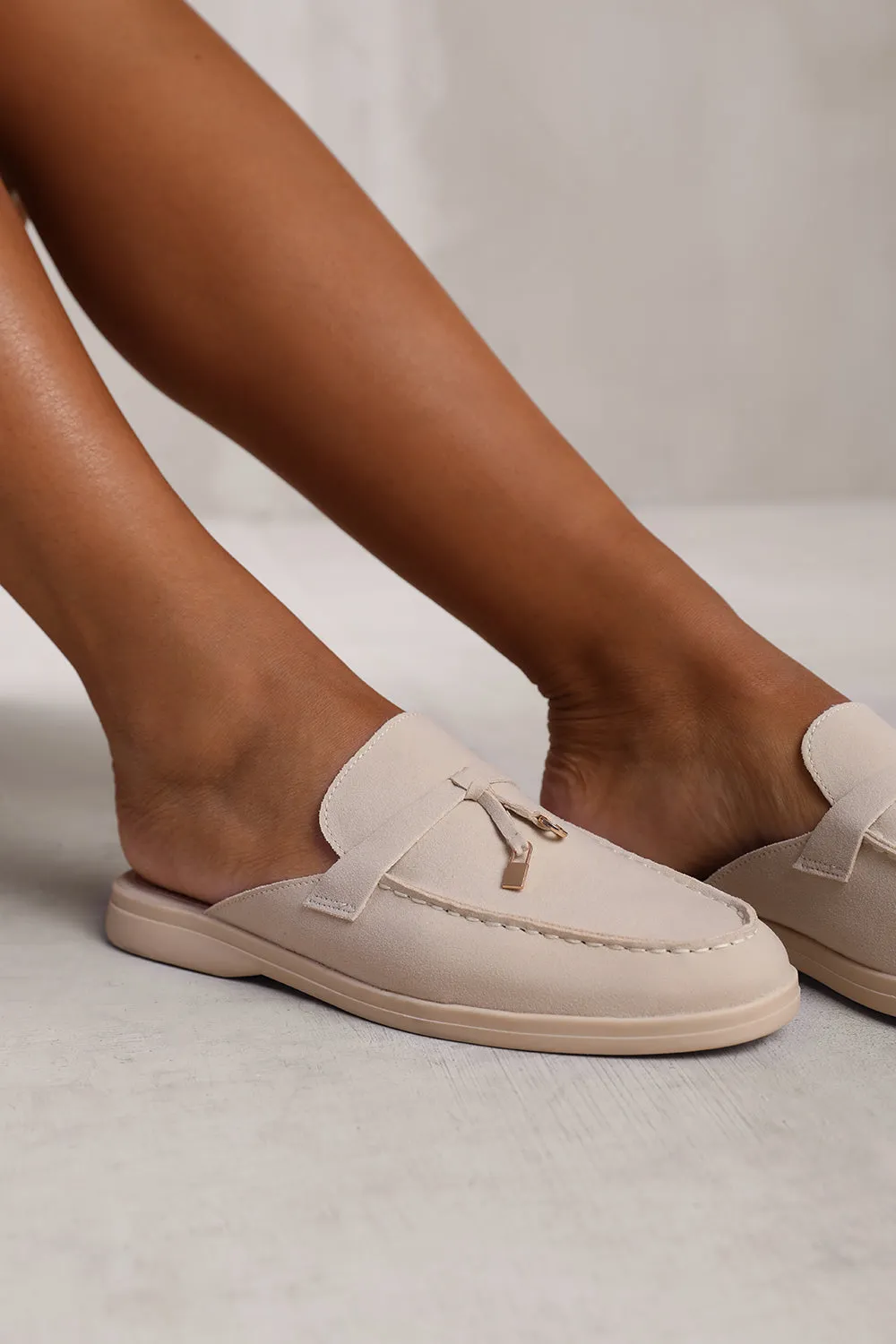 TWILIGHT FLAT SLIP ON LOAFER WITH TASSEL DETAIL IN BEIGE SUEDE